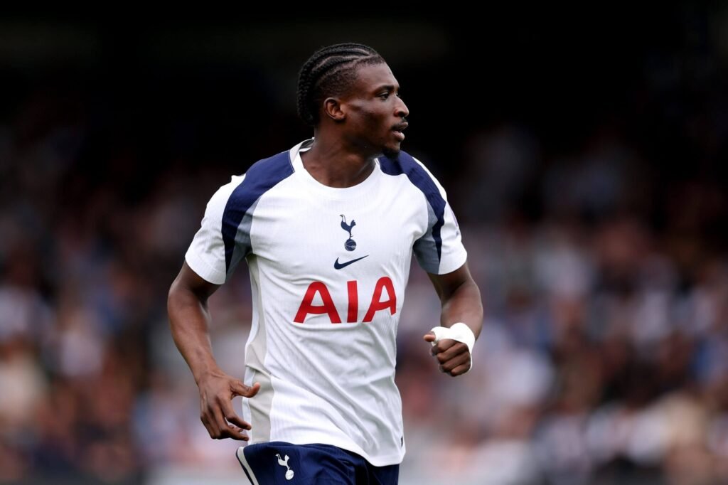 Tottenham Hotspur player Mohammed Kudus celebrating after scoring a goal in the Premier League match.